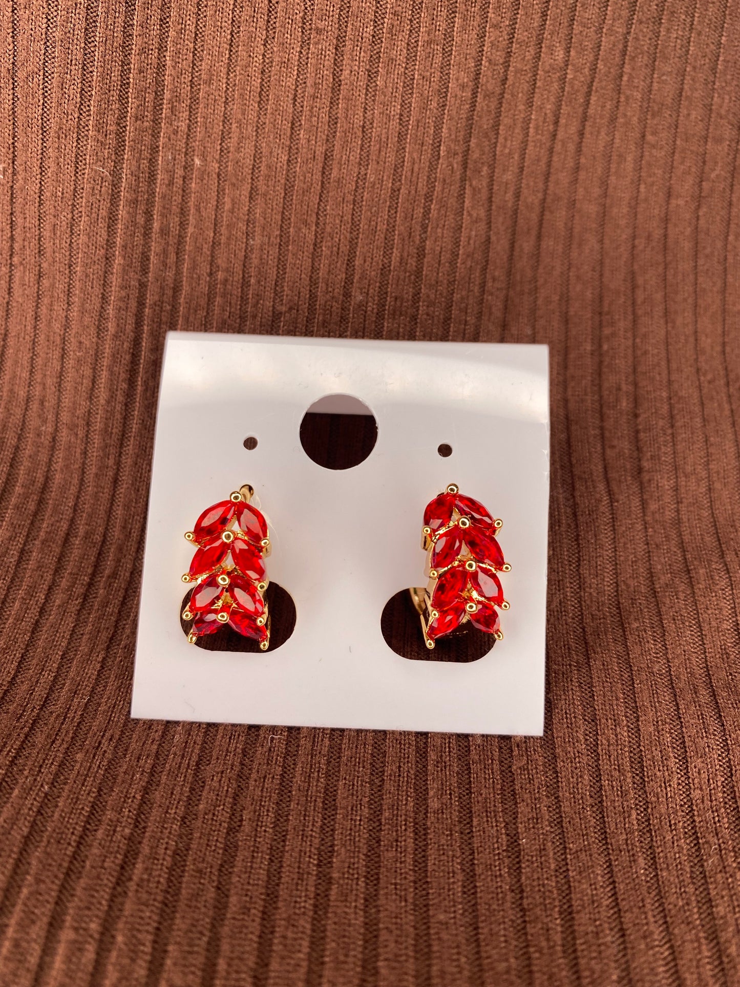 Red huggie earrings